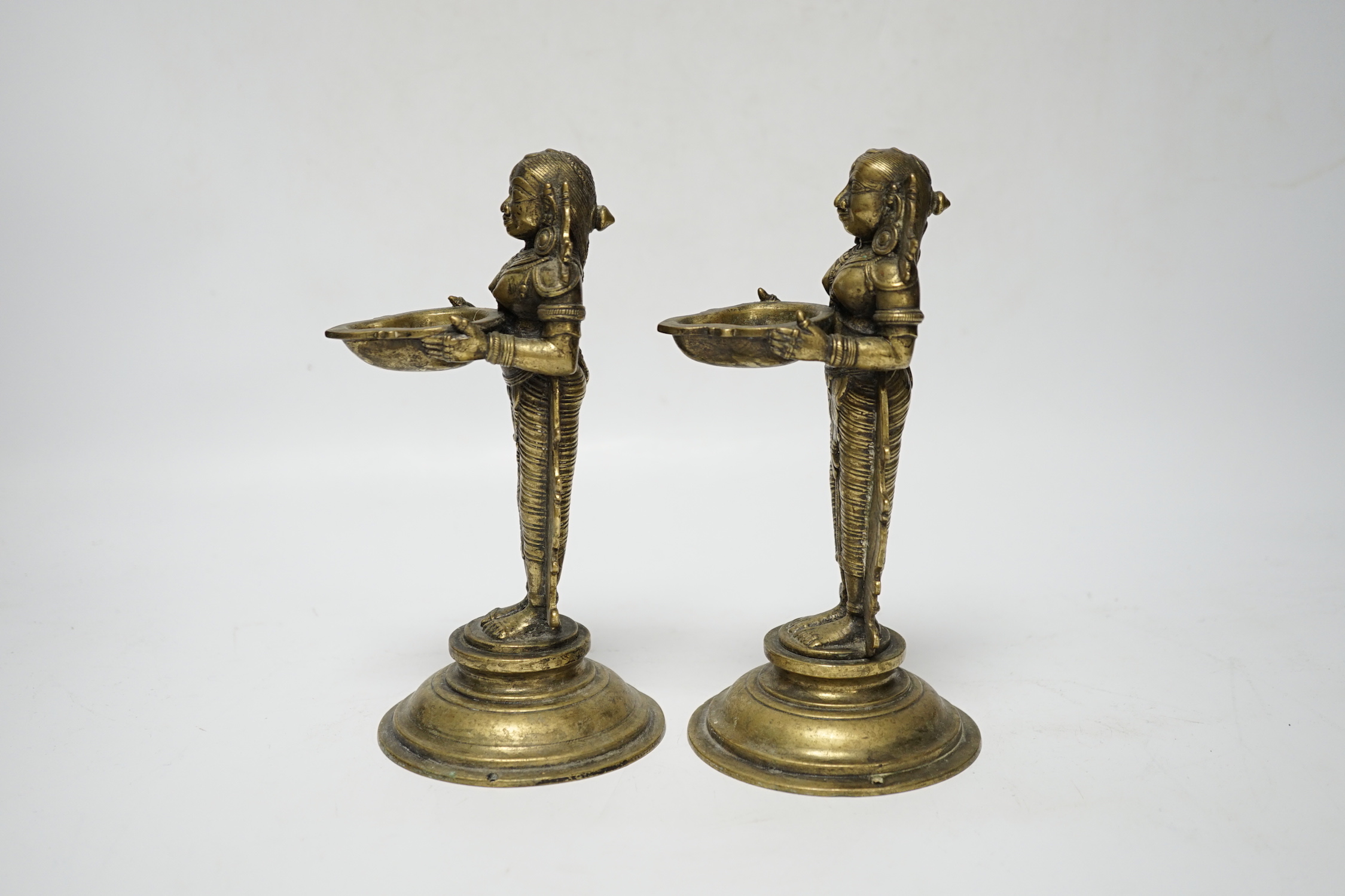 A pair of 19th century Indian ‘Deepalakshni’ butter oil lamps, 19cm high